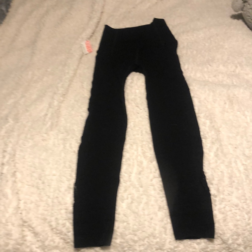 Free People black High Waisted leggings.